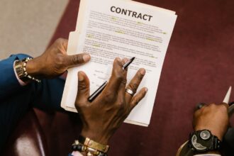Legal contract being reviewed, illustrating the AFM Warner AI licensing dispute