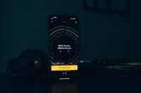 Smartphone music application representing digital music releases and AI detection