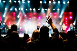 Large concert audience watching a live stage performance