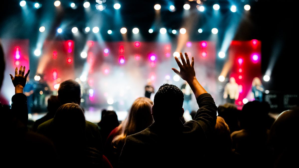 Large concert audience watching a live stage performance