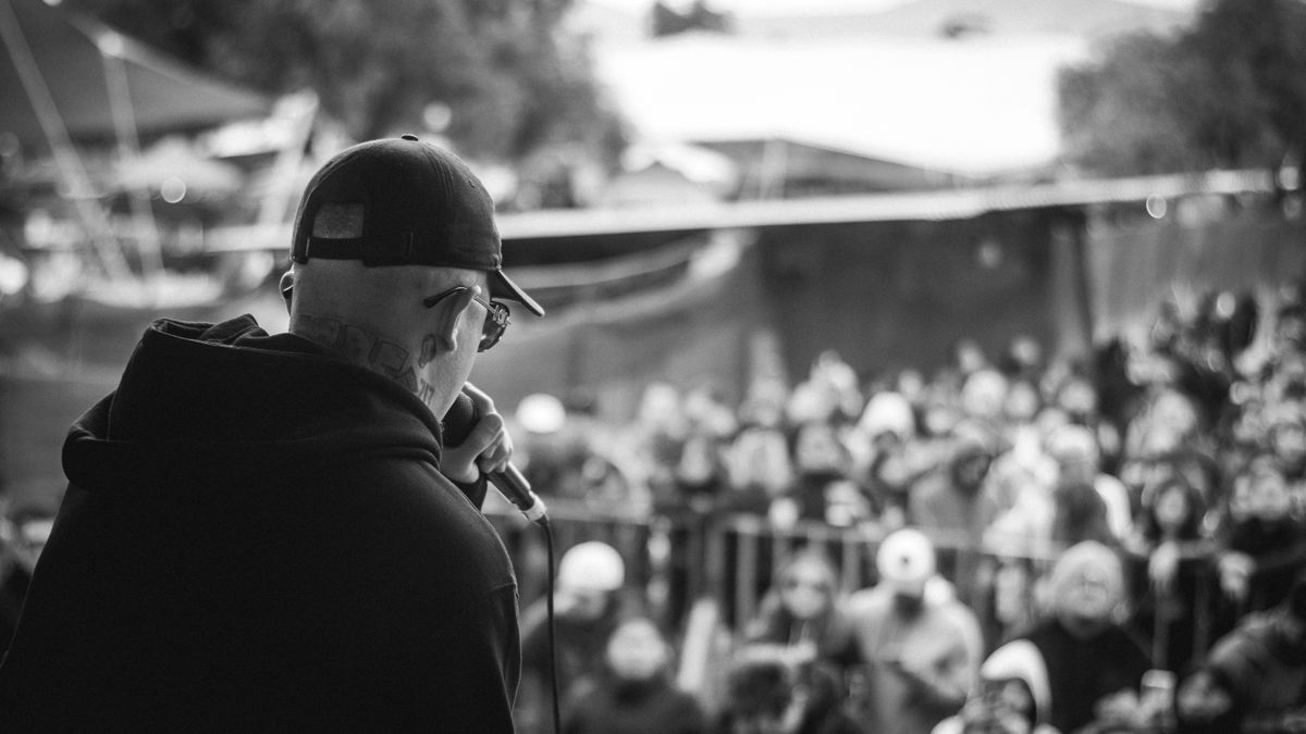 Singer performing in front of a concert audience representing a live music trademark dispute