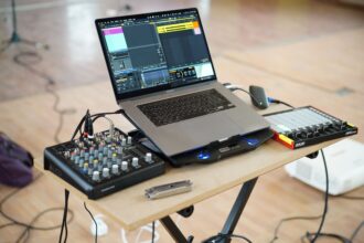 Computer and music production equipment representing Suno AI training and YouTube stream-ripping case