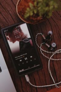Smartphone and earphones representing high quality digital music listening