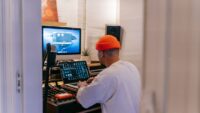 Independent music producer working in a recording studio