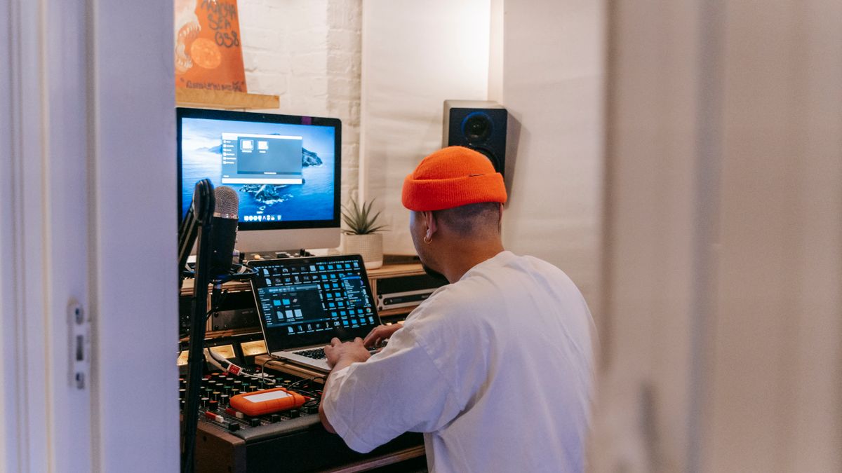 Independent music producer working in a recording studio