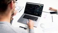 Financial market chart on a laptop illustrating Spotify share buyback